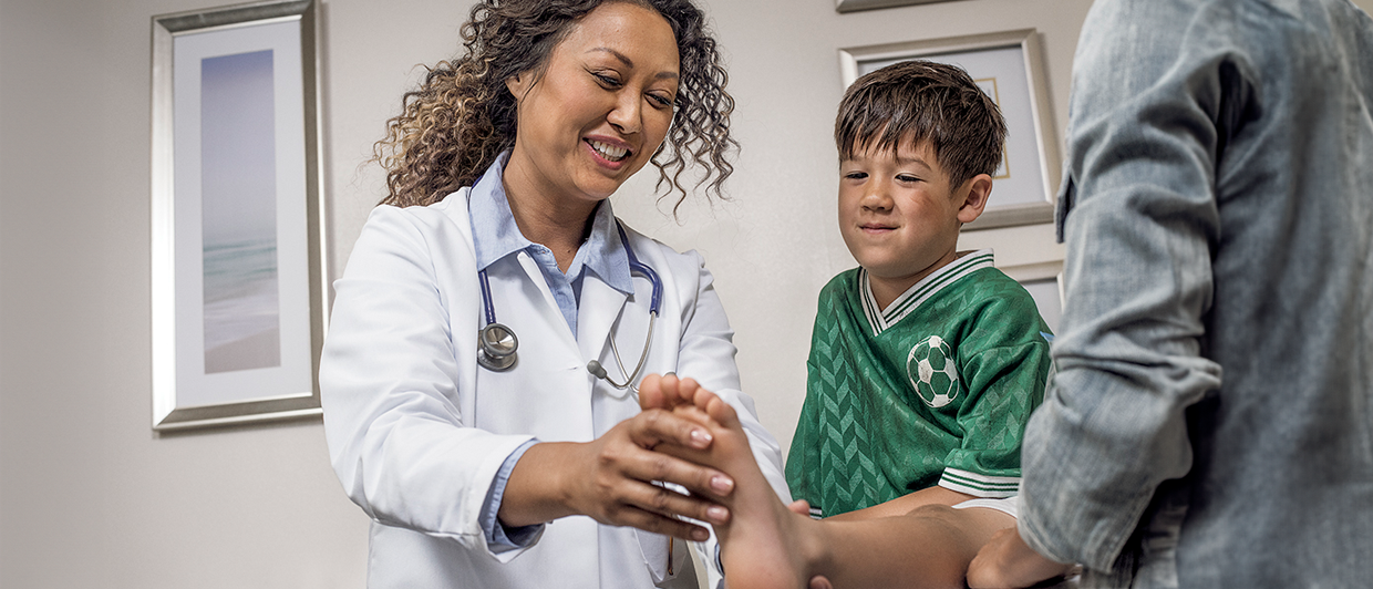 doctor examining child
