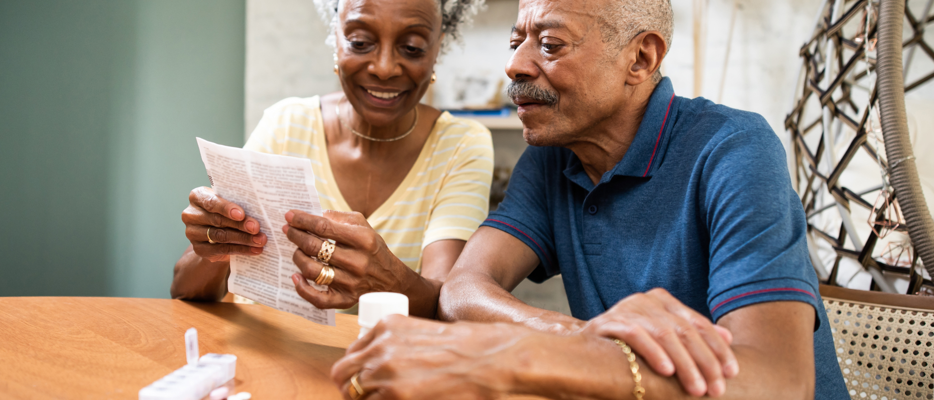 Woman and man reading pill insert
